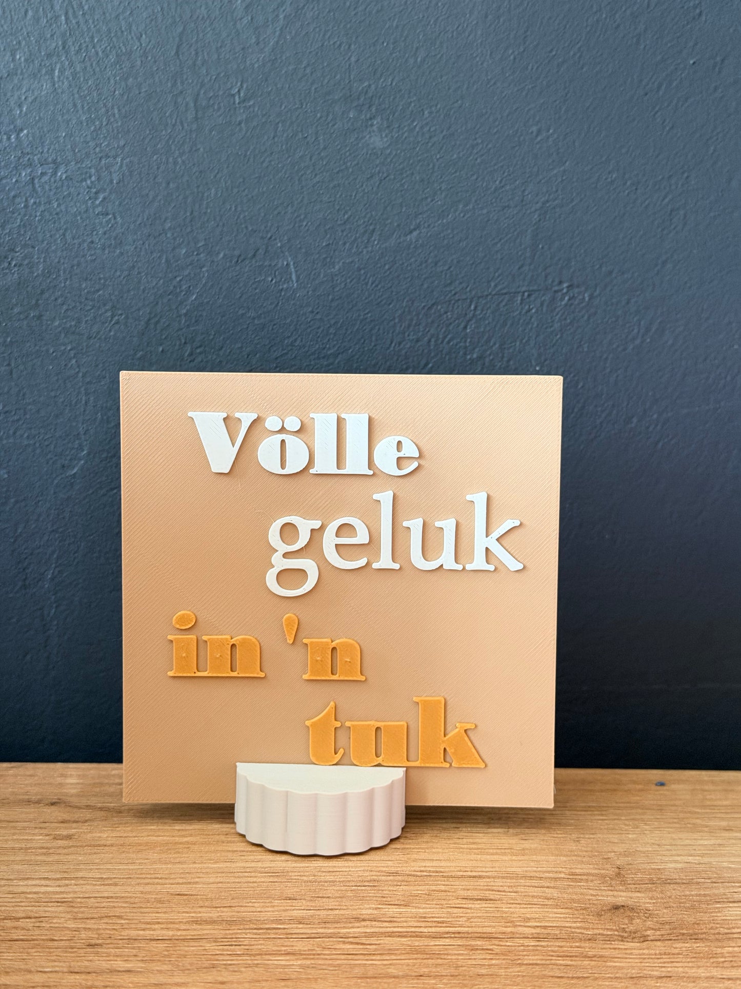 Tegeltje Völle geluk in 'n tuk